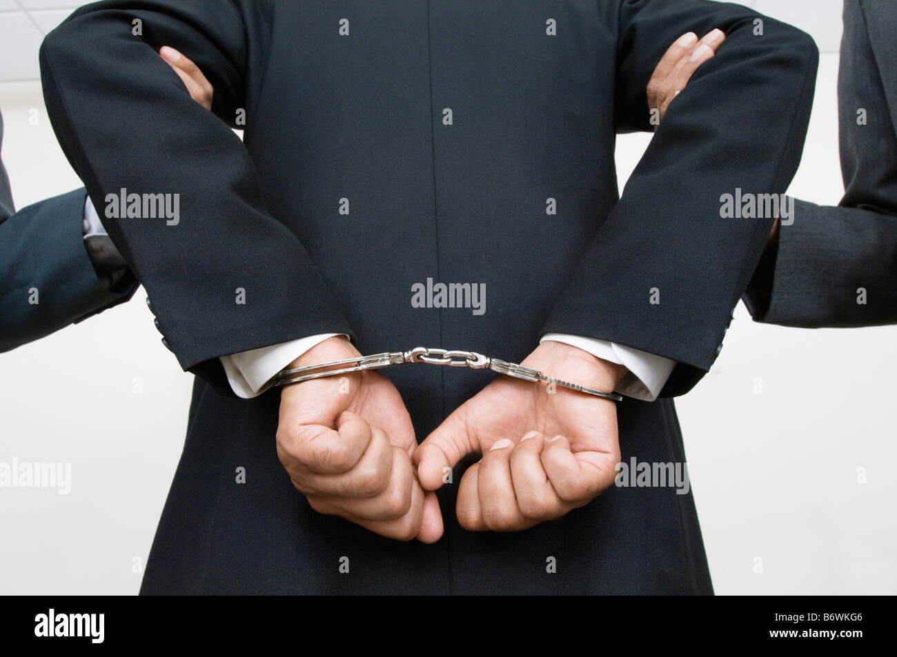 Businessman Being Arrested Stock Photo