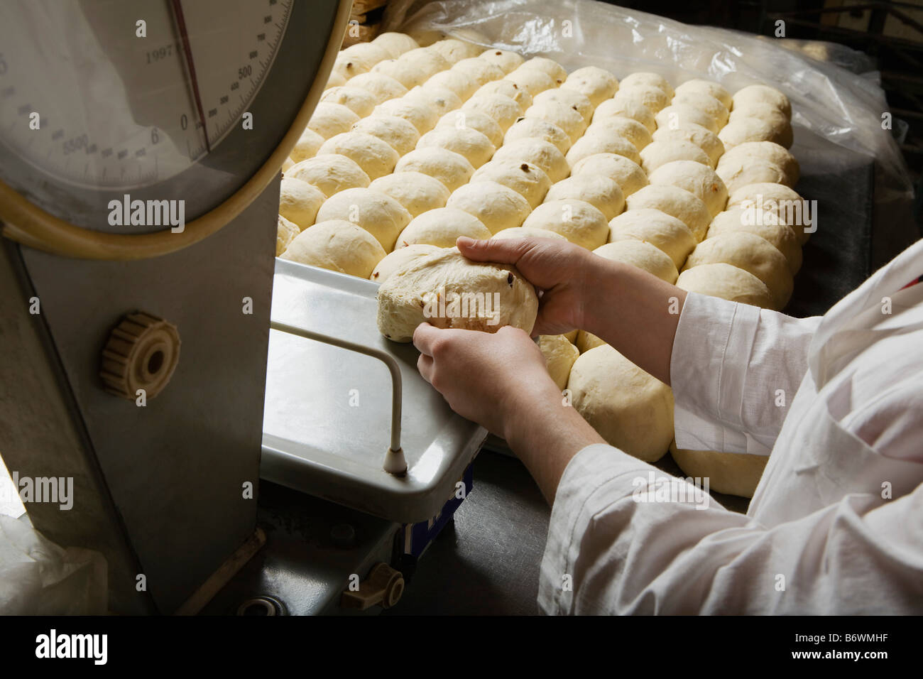 Baker Weighing Balls of Bread Dough Stock Photo - Alamy