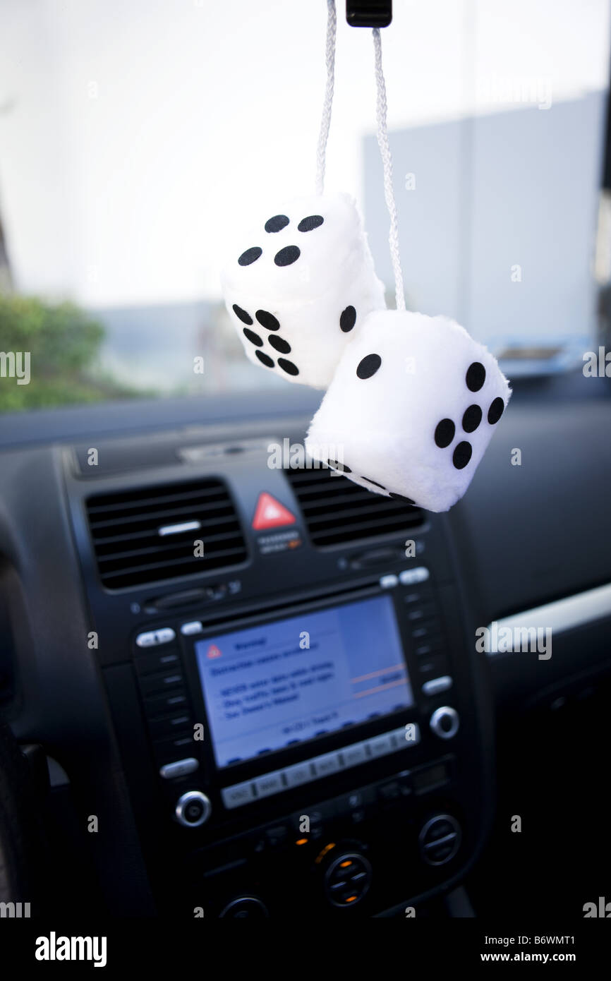 Interior view of fuzzy dice in car Stock Photo Alamy