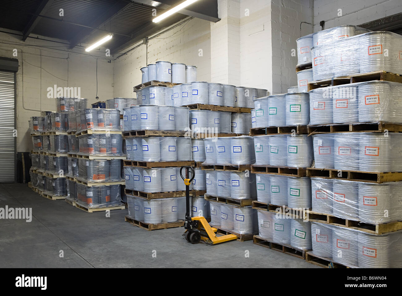 Stack of pallets in a warehouse Stock Photo Alamy