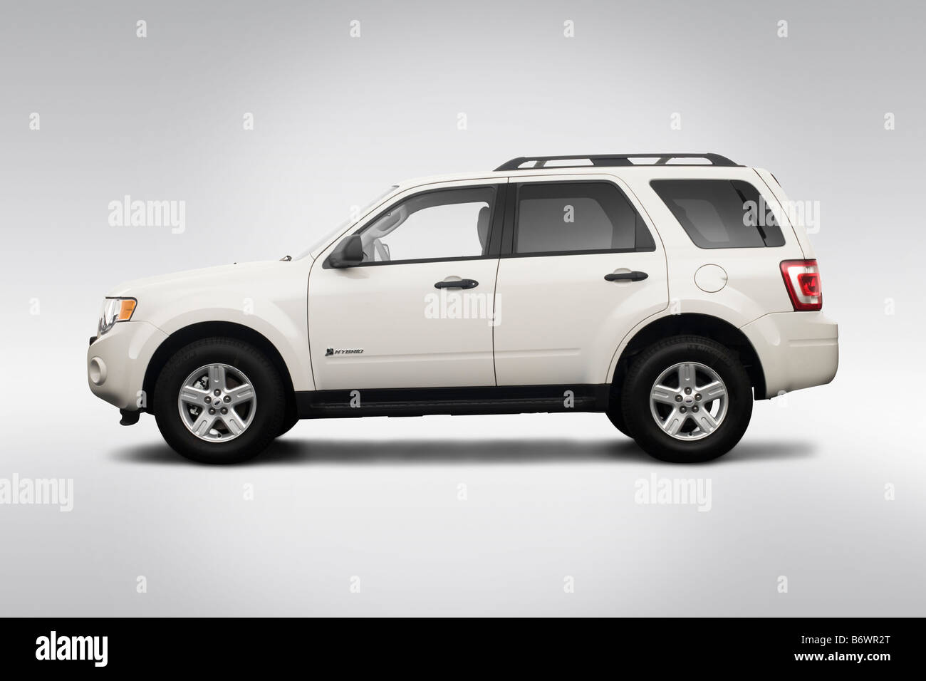 2009 Ford Escape Hybrid in White - Drivers Side Profile Stock Photo - Alamy