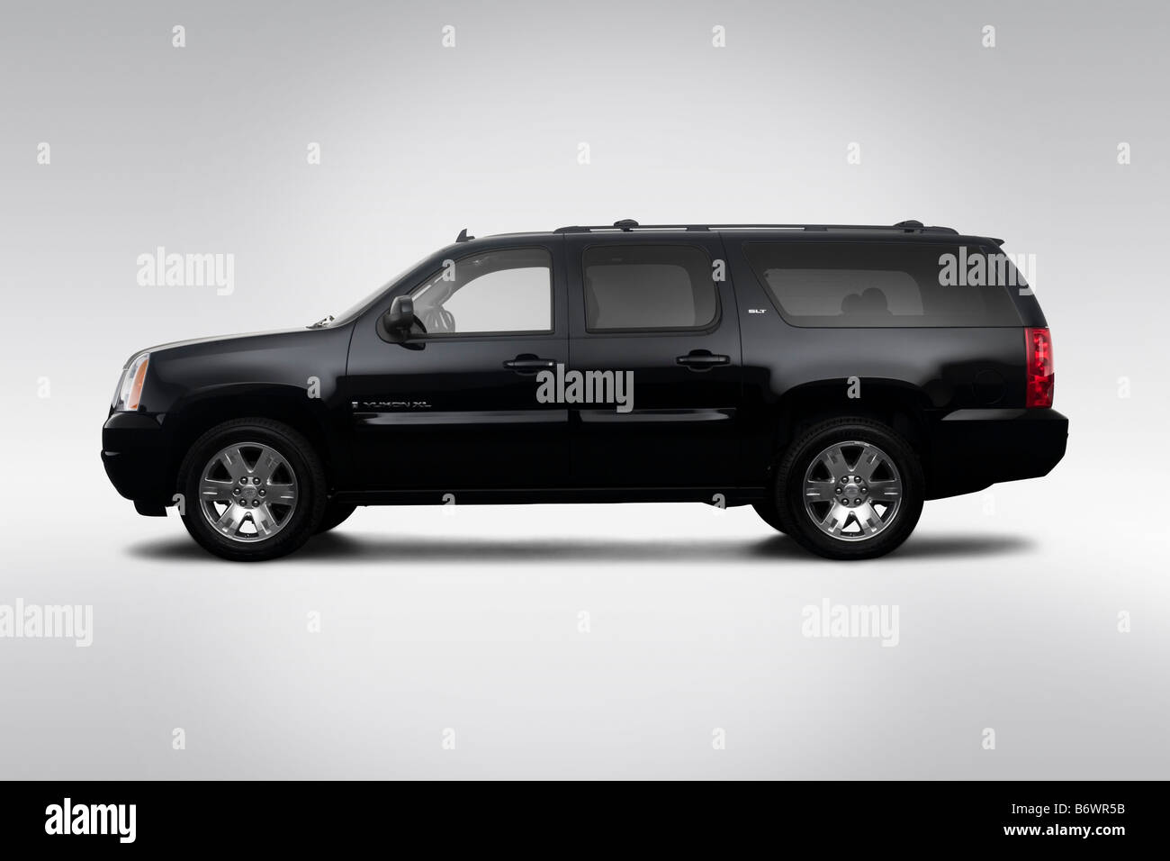 2009 GMC Yukon XL SLT in Black - Drivers Side Profile Stock Photo