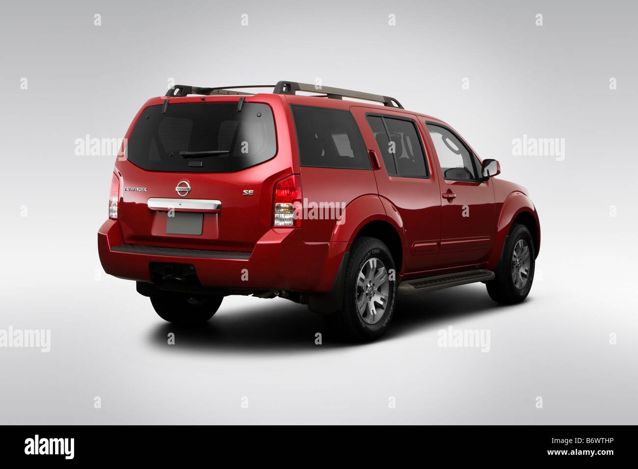2009 Nissan Pathfinder SE in Red - Rear angle view Stock Photo