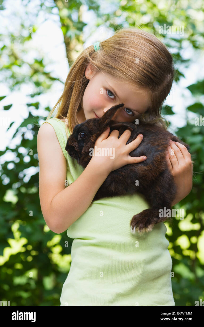 Girl holding a rabbit hi-res stock photography and images - Alamy