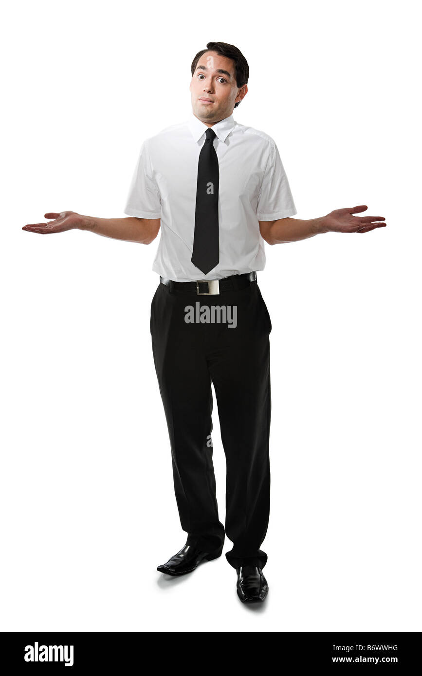 Young man shrugging Stock Photo Alamy