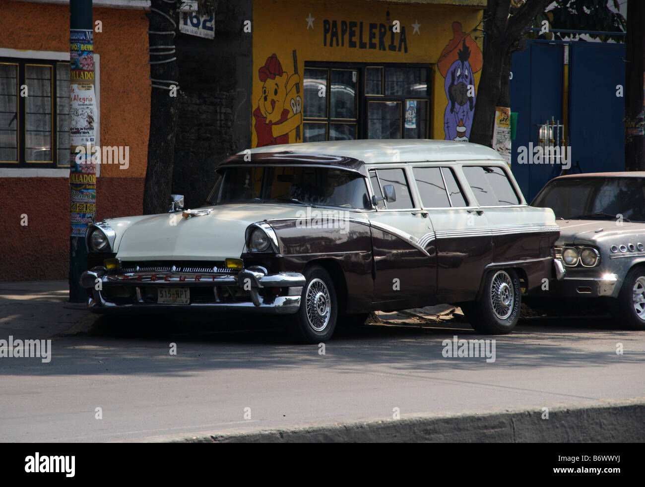 Mexico, Mexico City. A classic car parked in the north of Mexico City