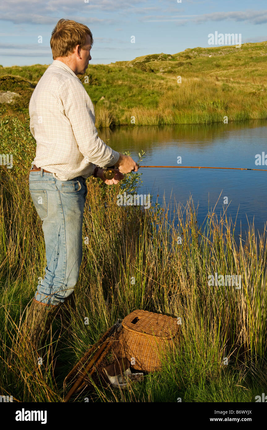 UK, Wales, Conwy. Trout fishing at a hill lake in North Wales (MR) Stock Photo