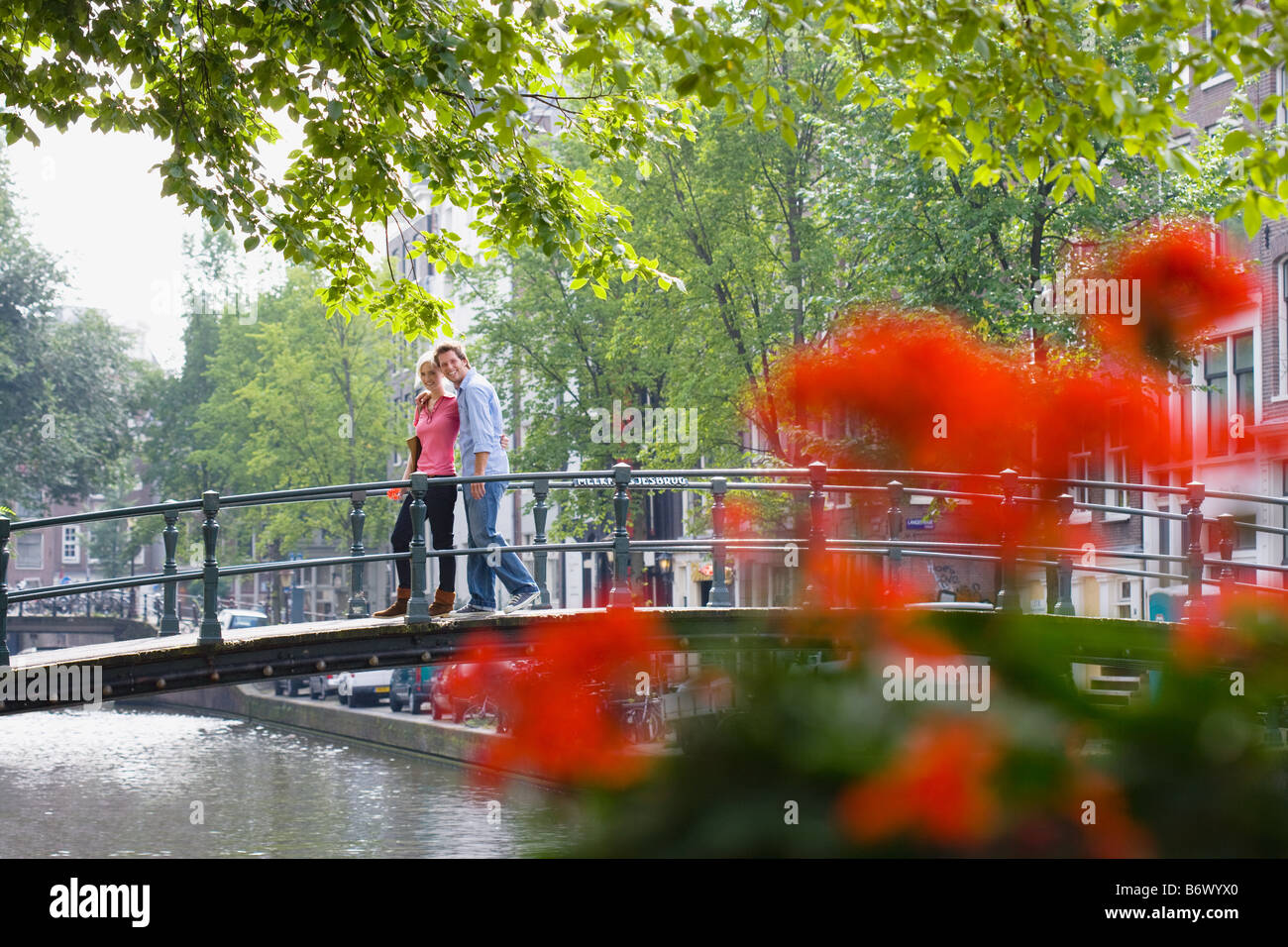 Couple on a bridge Stock Photo - Alamy