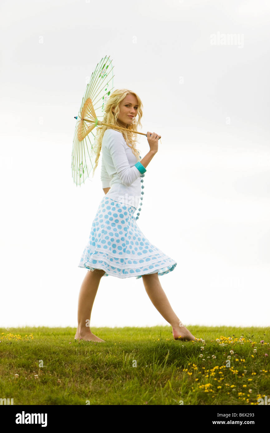 Woman alone walking barefoot grass hi-res stock photography and images ...