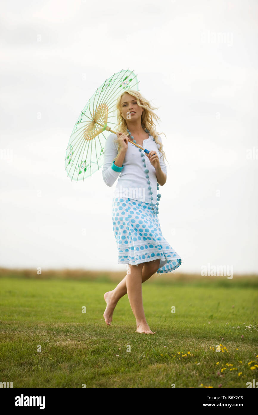 Woman alone walking barefoot grass hi-res stock photography and images ...