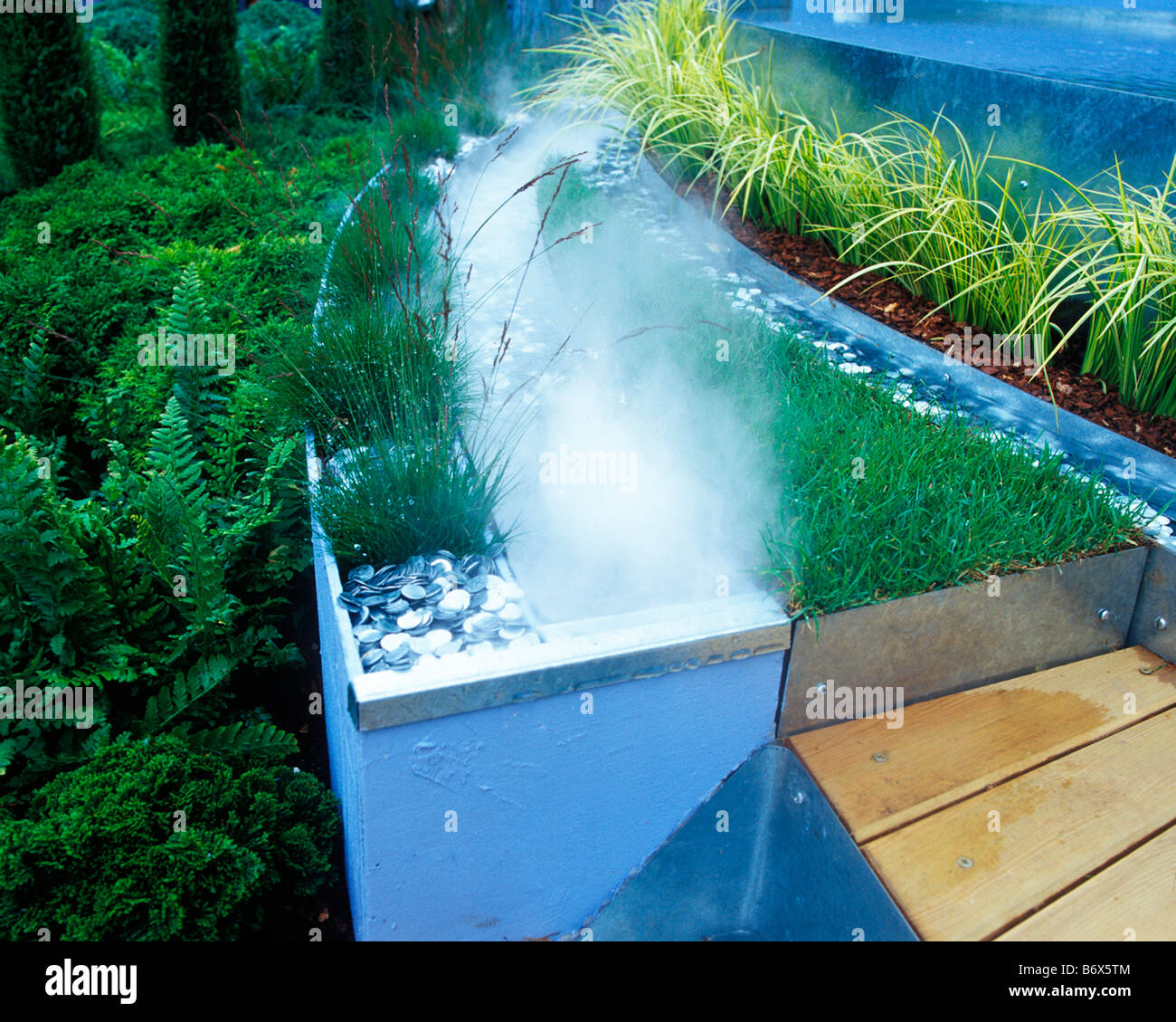 mist can be used effectively in modern water features Stock Photo Alamy