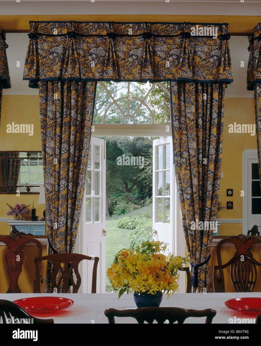 Patterned Curtains With Matching Pelmet At Open French Doors In