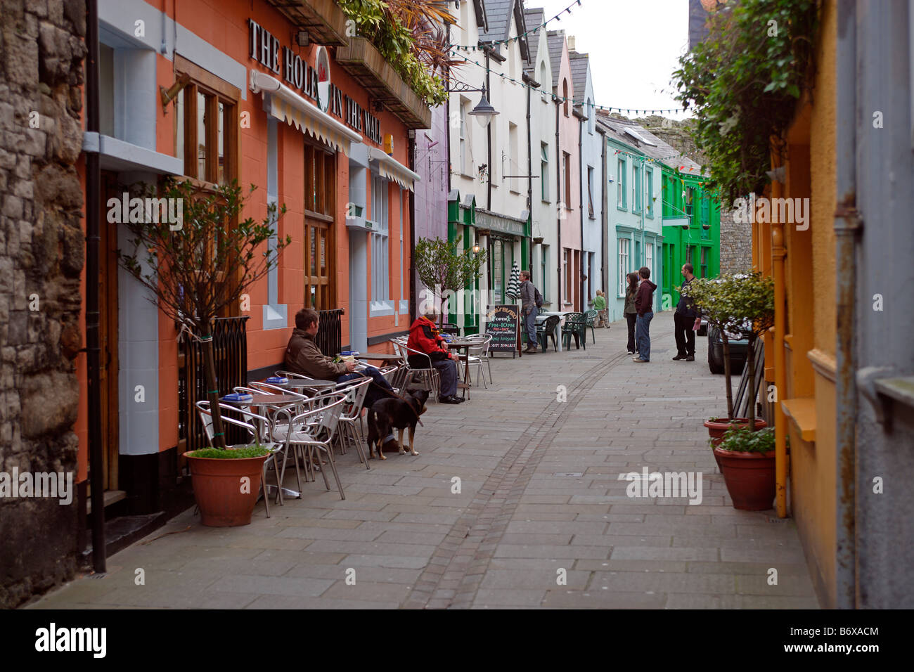 Caernarfon Hole In The Wall Street town center typical buildings Gwynedd Wales UK Stock Photo