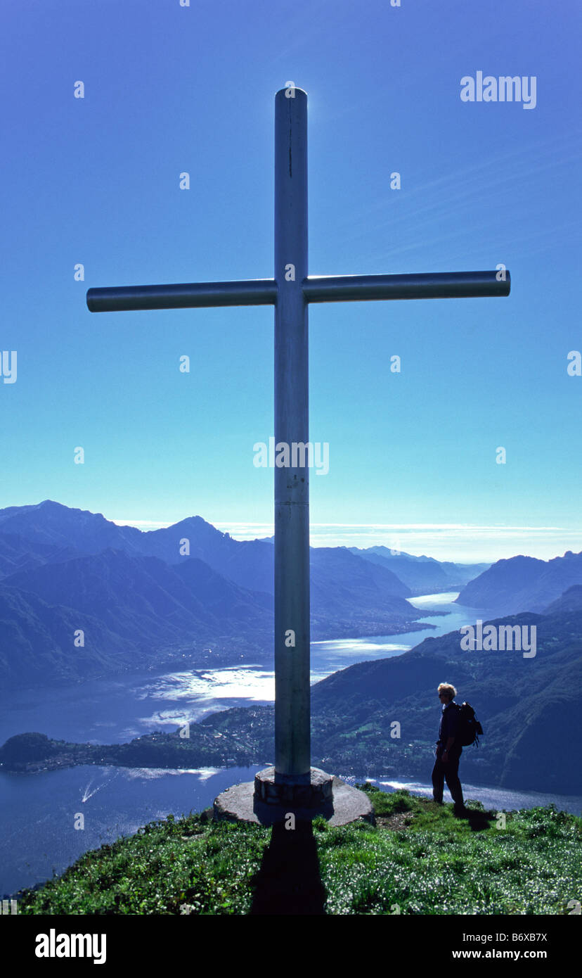 Cross on Monte Crocione near Monte Tremezzo, Lombardy, Italy. View over Lake Como and Bellagio. Stock Photo