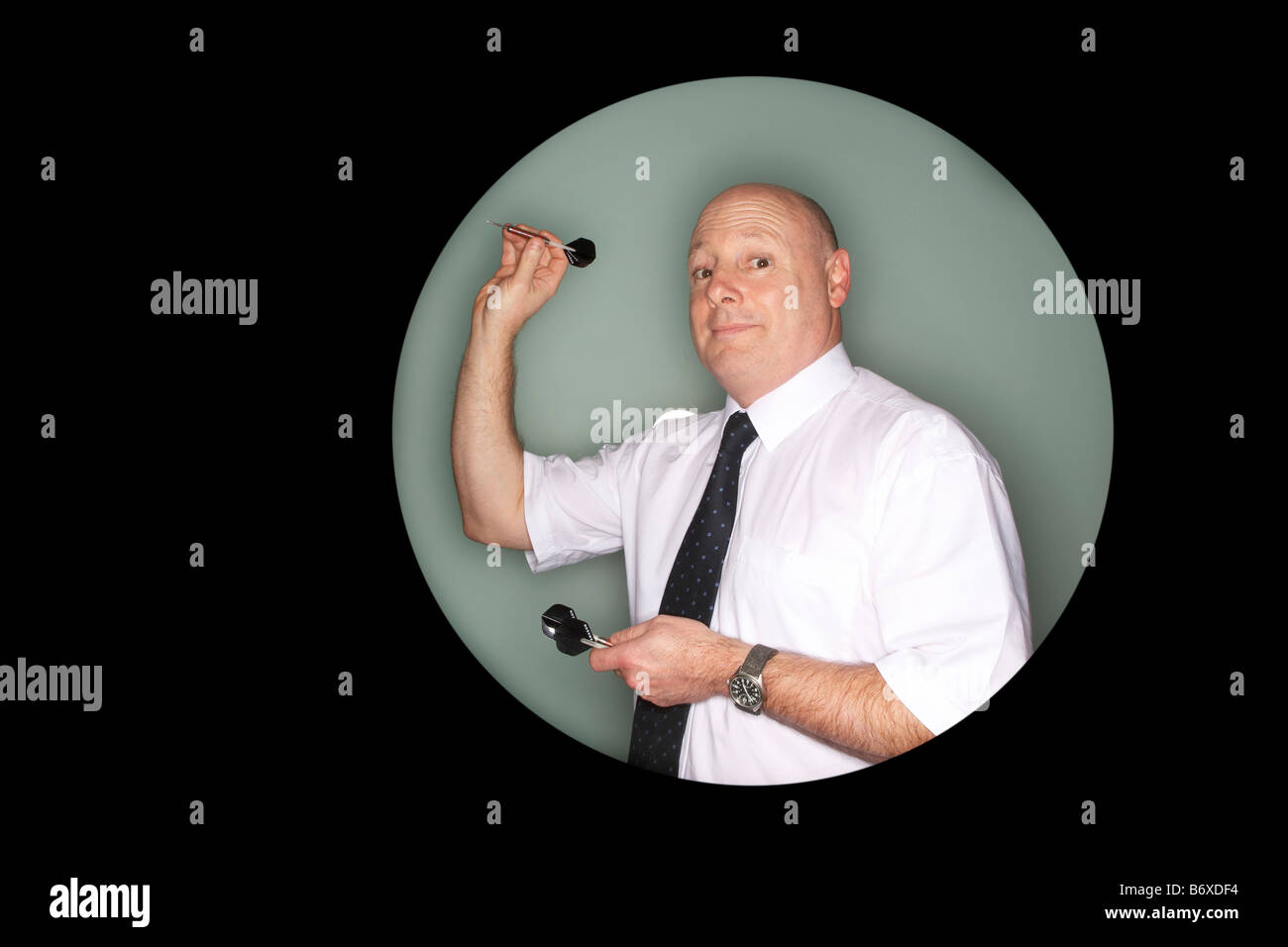 Man throwing darts Stock Photo