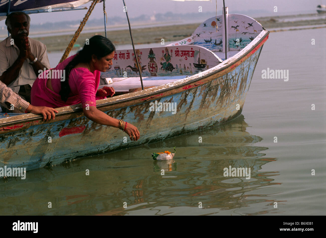 india, uttar pradesh, allahabad, sangam, people giving offerings at the confluence of the rivers ganges and yamuna Stock Photo