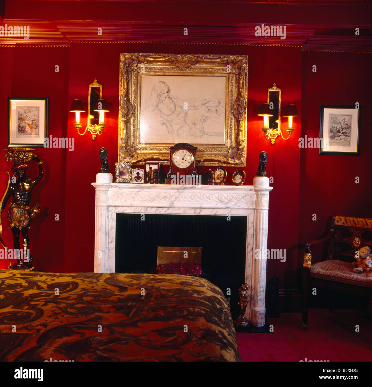 Wall Lights On Either Side Of Large Gilt Framed Drawing Above