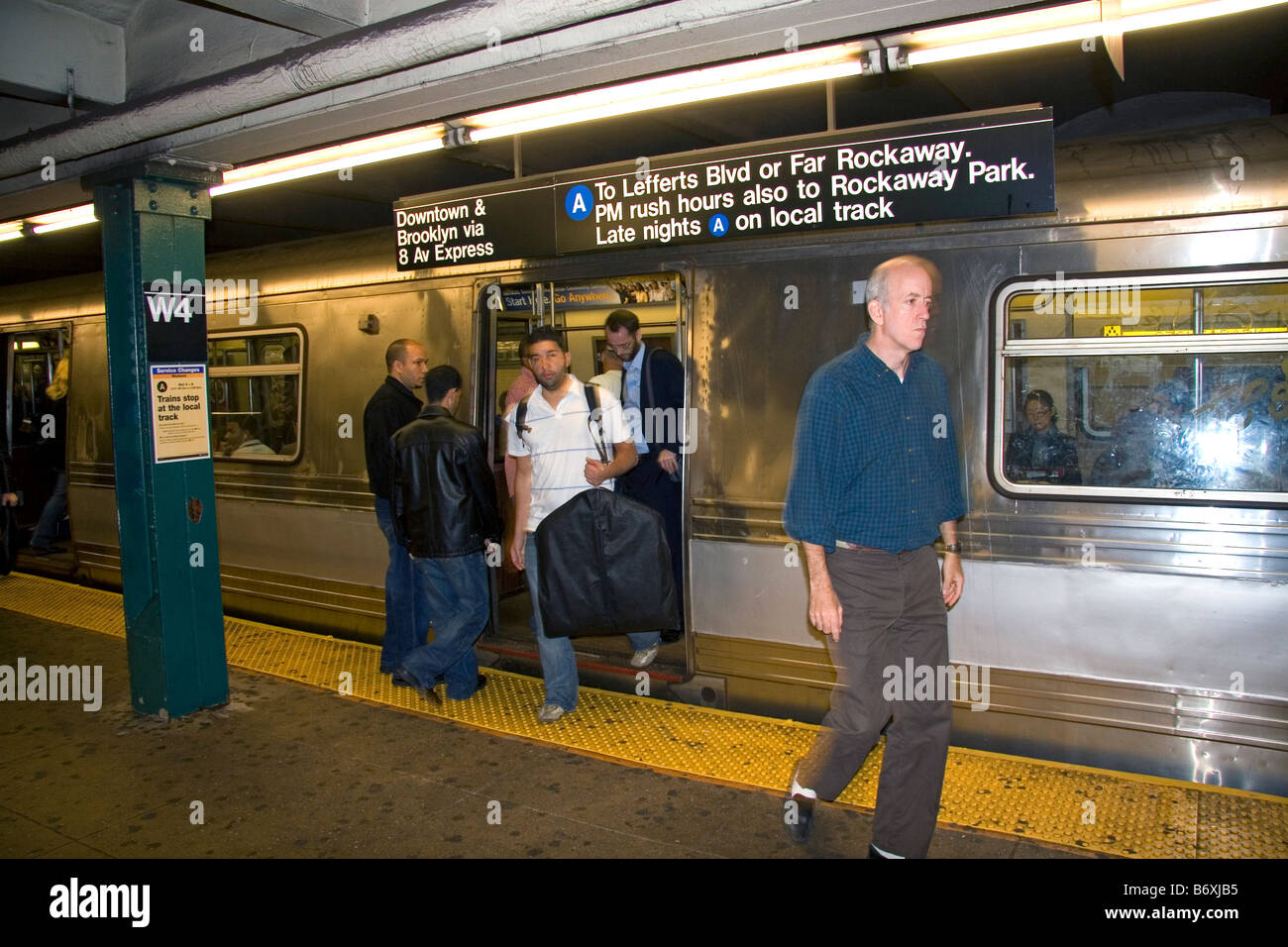 Passengers getting on and off the subway in lower Manhattan New York City New York USA Stock Photo