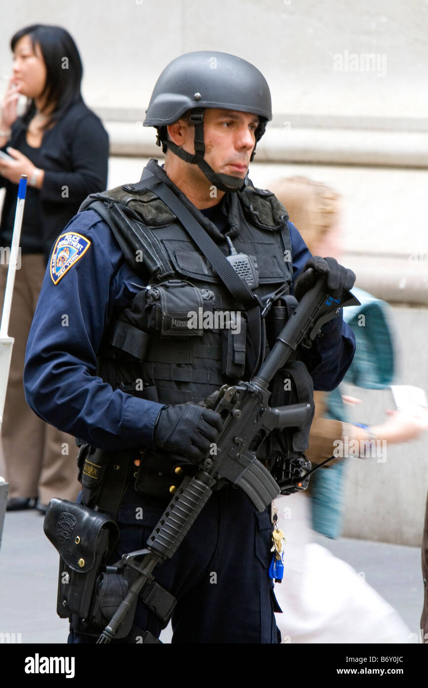 New York City Police Department Emergency Service Unit officer on Wall Street in New York City New York USA Stock Photo