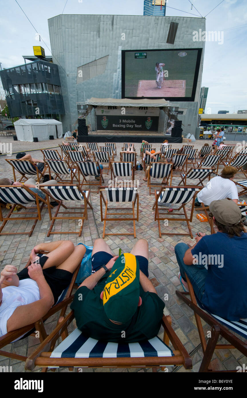 Australians watching test cricket on a large screen in Federation Square Melbourne Stock Photo