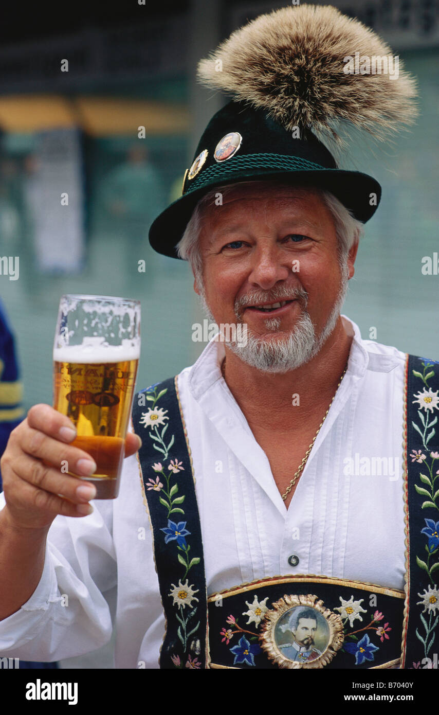 Portrait of a mature Bavarian holding a glass of beer, Munich, Germany Stock Photo