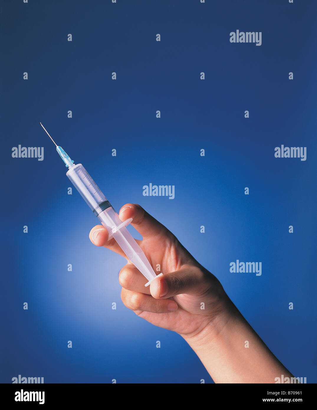 one hand holding needle Stock Photo Alamy