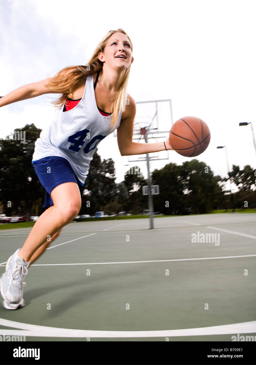 Action shot of a woman playing basketball Stock Photo Alamy