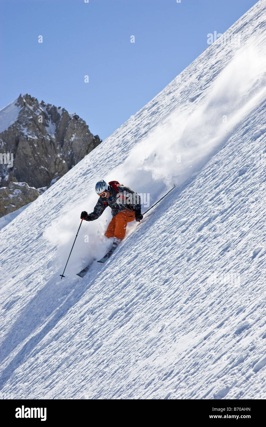 A young man skis untracked powder offpiste at St. Anton am Arlberg
