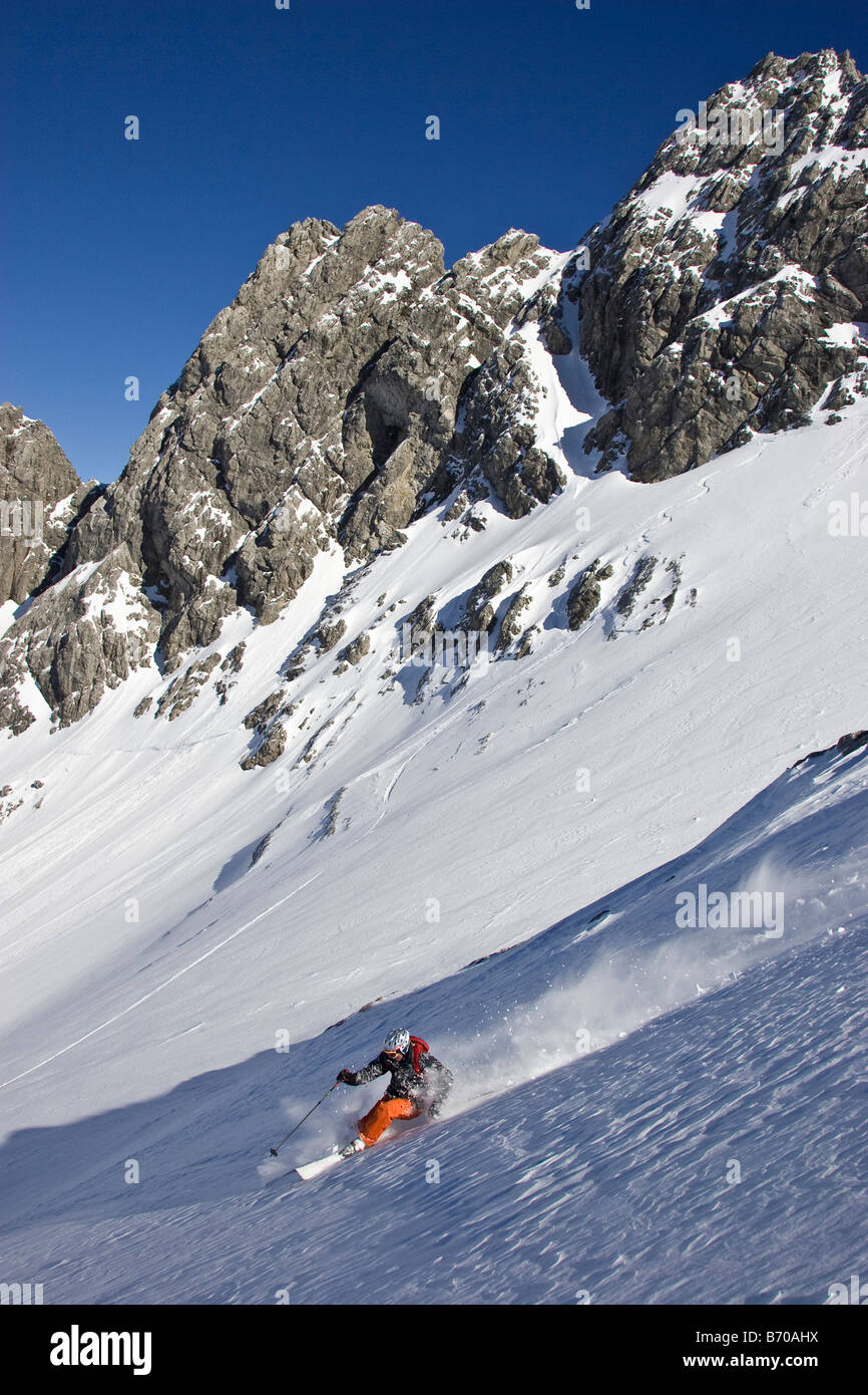 A young man skis untracked powder offpiste at St. Anton am Arlberg