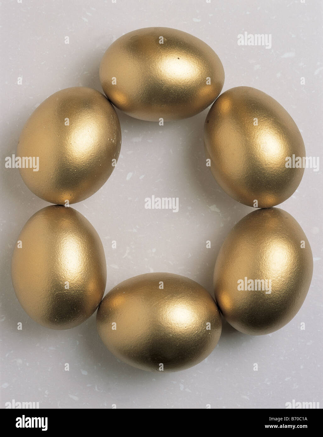 Six golden eggs form a roundshape Stock Photo Alamy