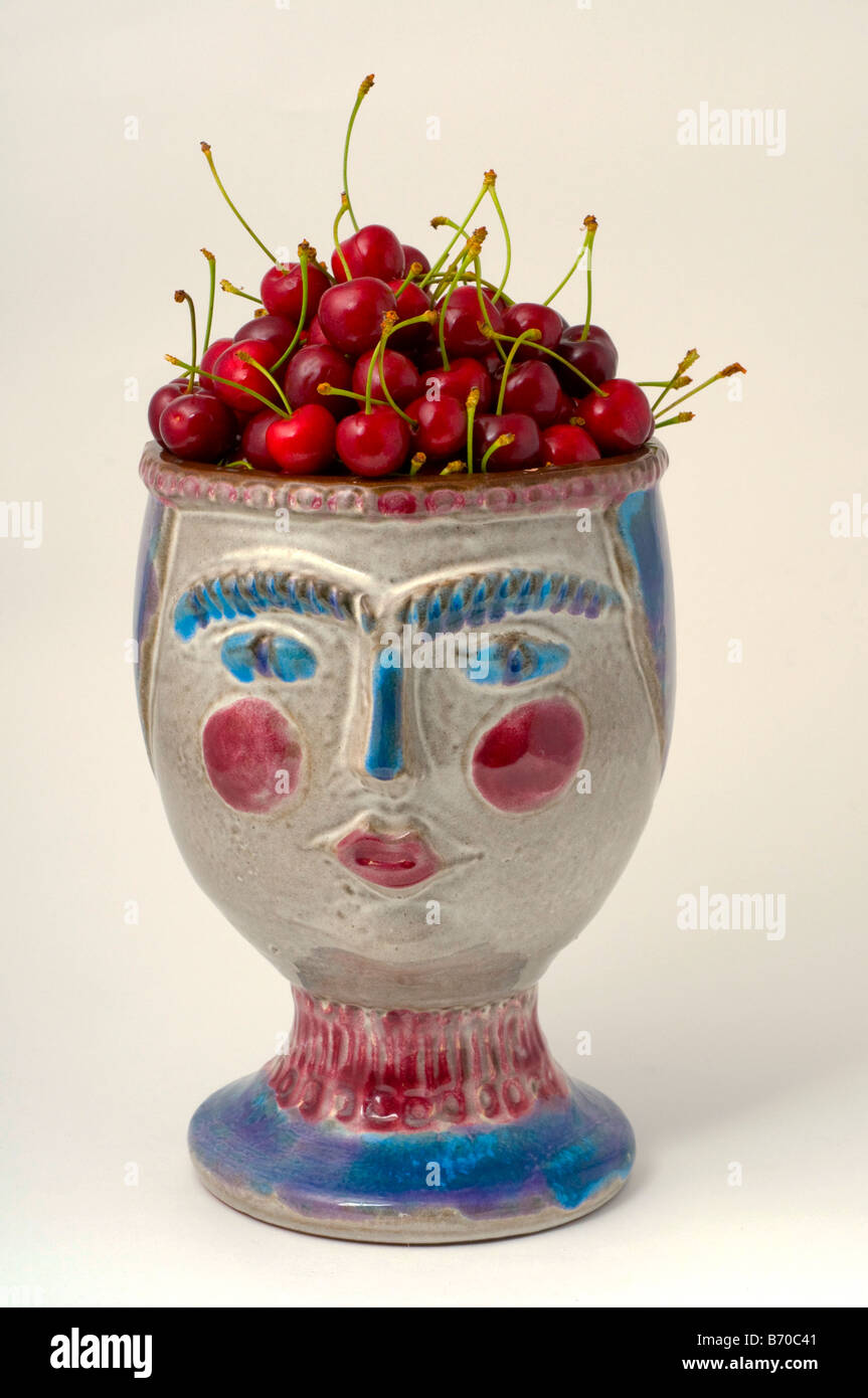 Ripe cherries in bowl Stock Photo