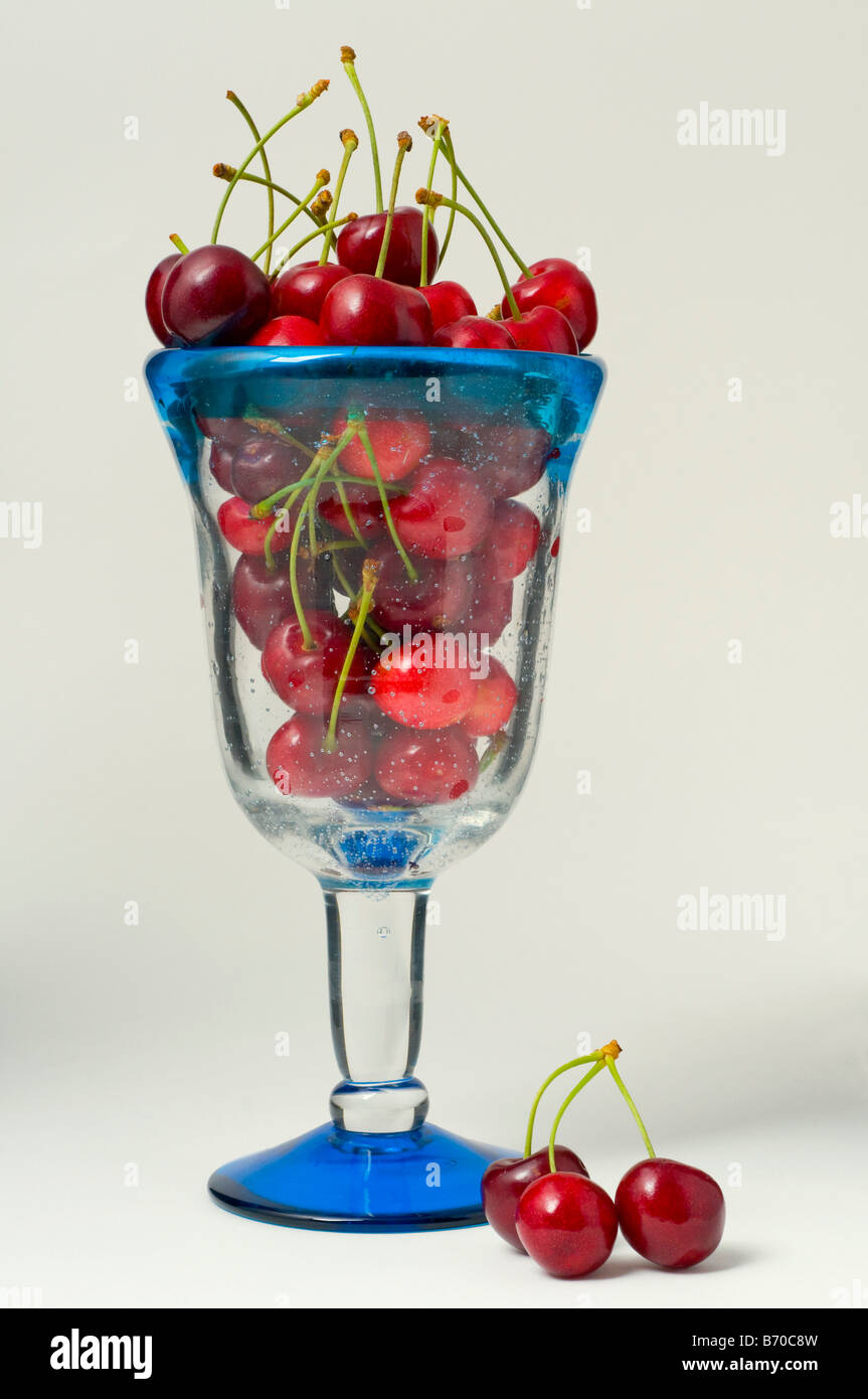 Ripe cherries in a glass Stock Photo
