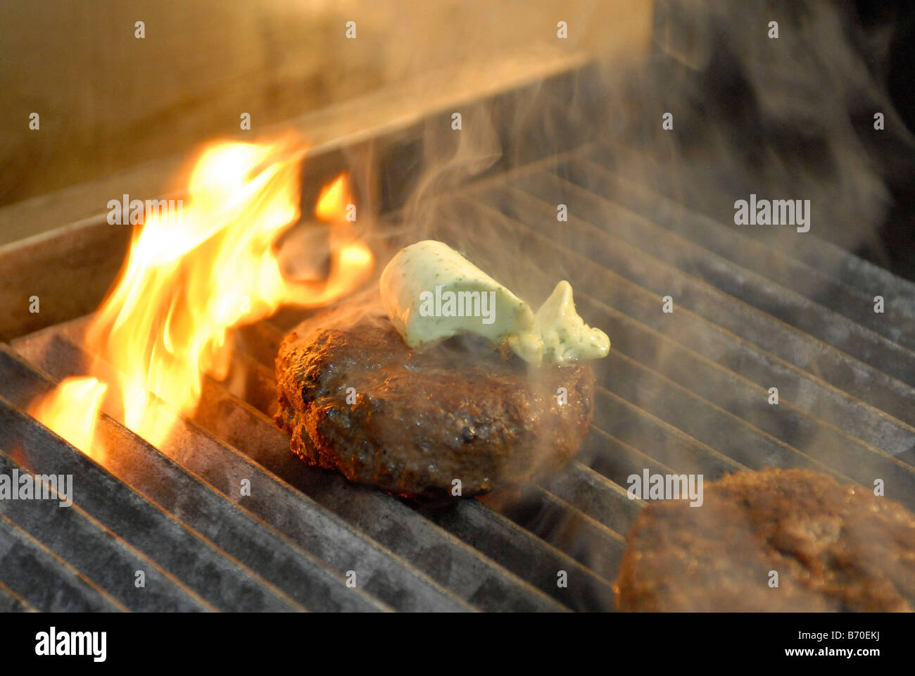 Grilling Steak with garlic butter Stock Photo - Alamy - Grilling Steak With Hot Sauce And Butter