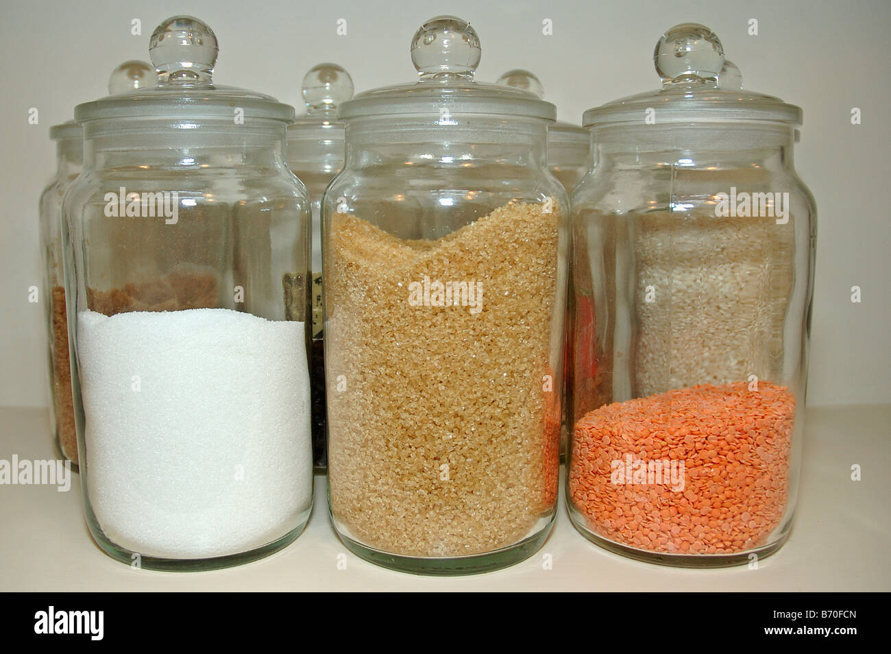 Close-up of glass storage jars of red lentils, brown sugar and salt Stock  Photo - Alamy