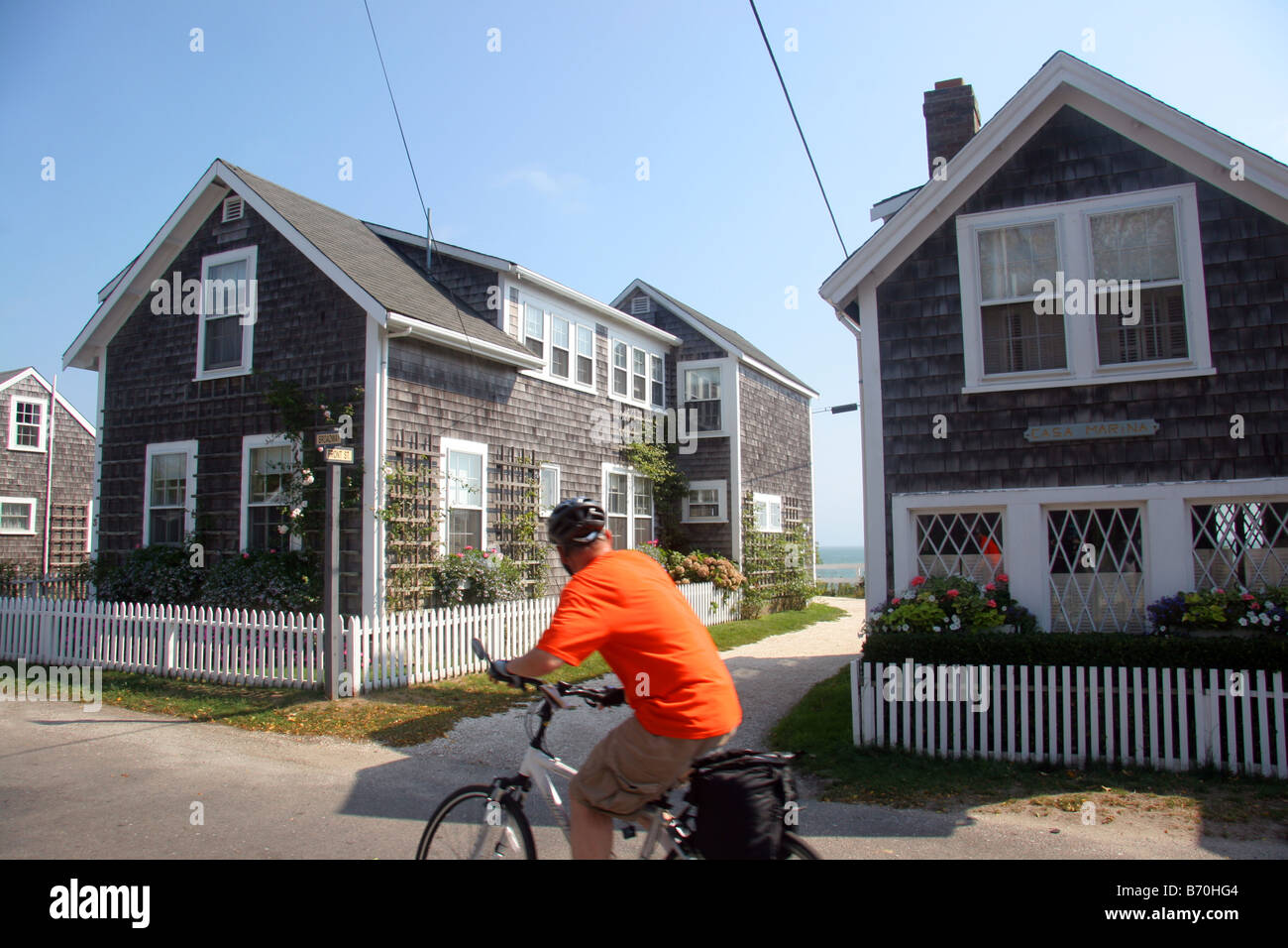 Tourist cycling in Sconset Nantucket Island Cape Cod USA Stock Photo