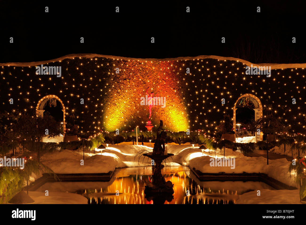 Italion garden pond with Christmas lights at night Butchart Gardens