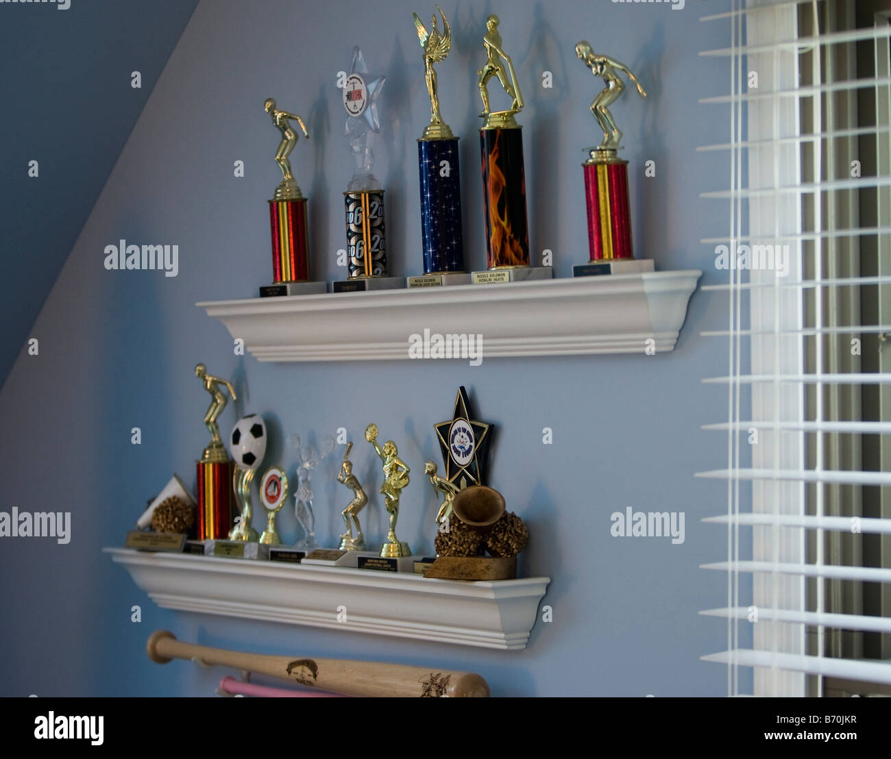 Trophies displayed on a shelf Stock Photo Alamy