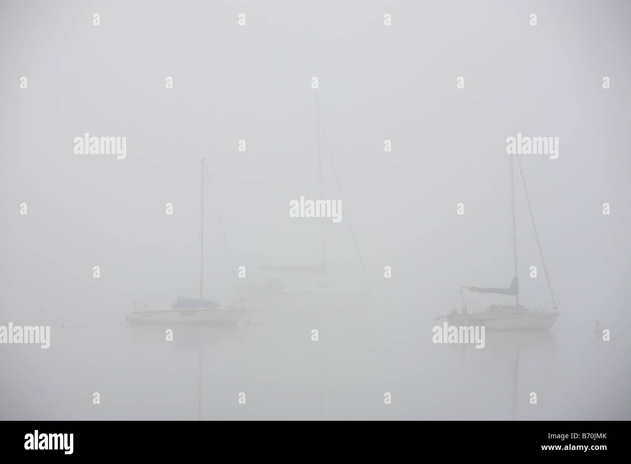 Mist over Lake Windermere in the Lake District UK Stock Photo