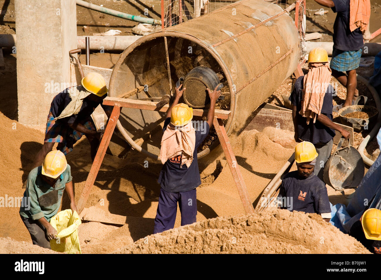 Construction workers work on a building site in the south Indian city