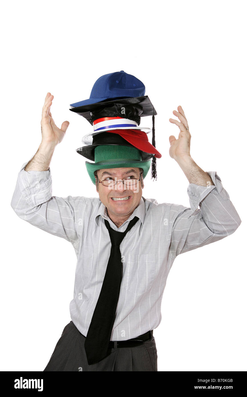 Businessman overwhelmed by too many responsibilities symbolized by