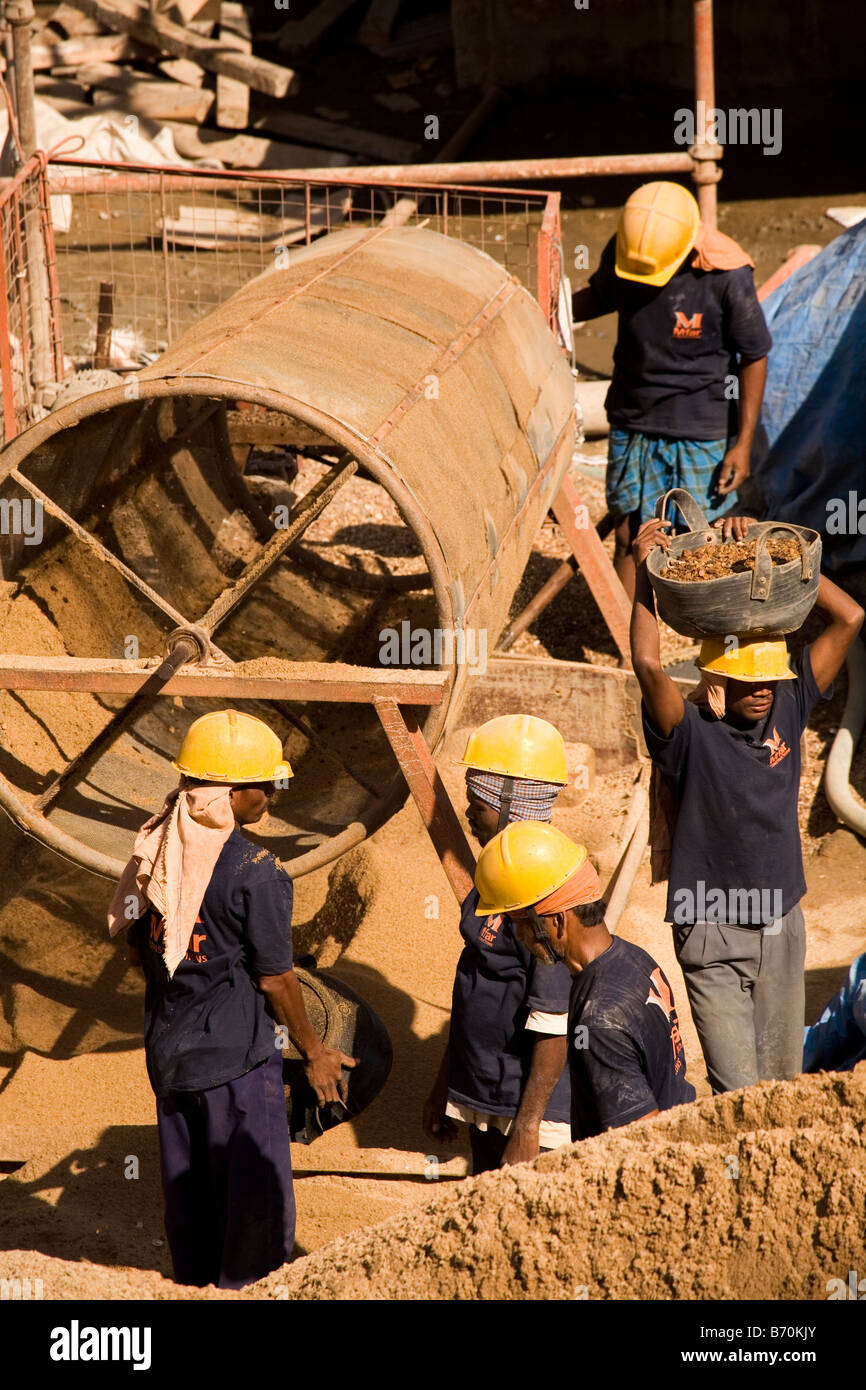 Construction workers work on a building site in the south Indian city