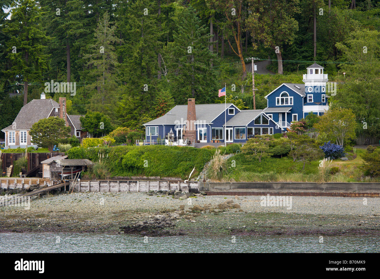 Residential homes along coastline of island in Puget Sound near Seattle Washington Stock Photo