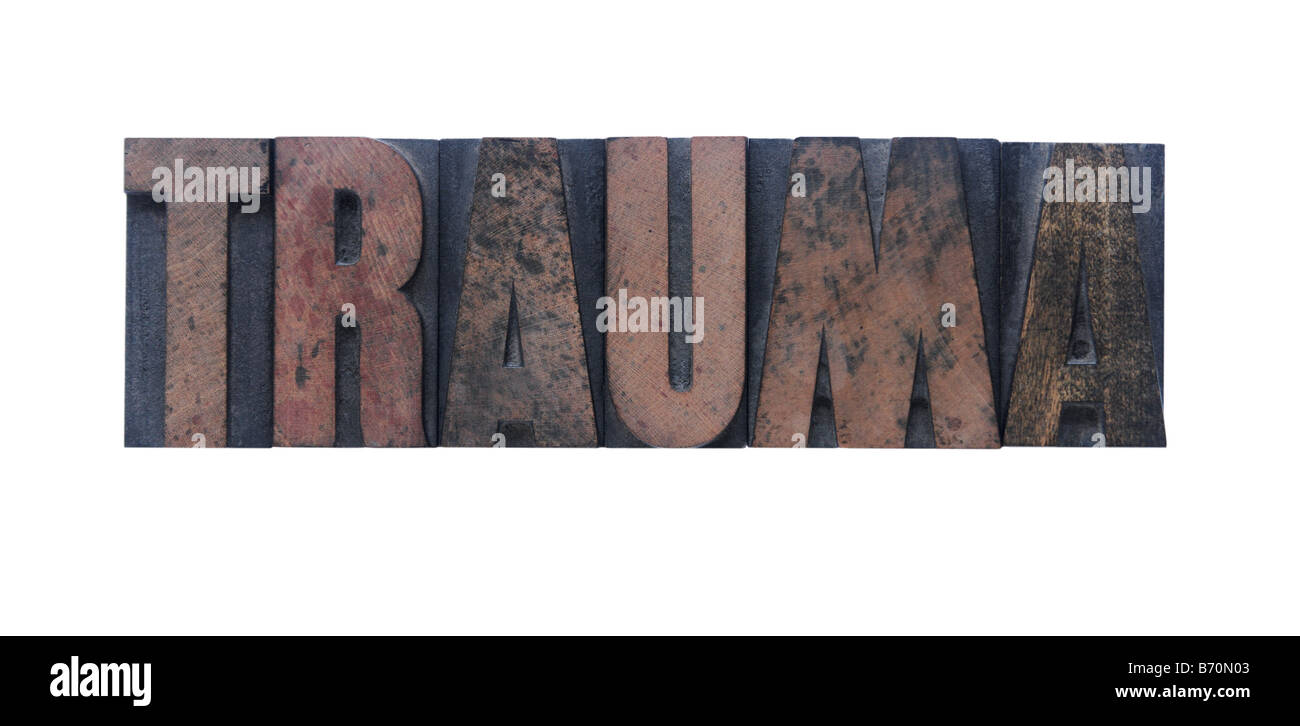 the word 'trauma' in old ink-stained wood type Stock Photo