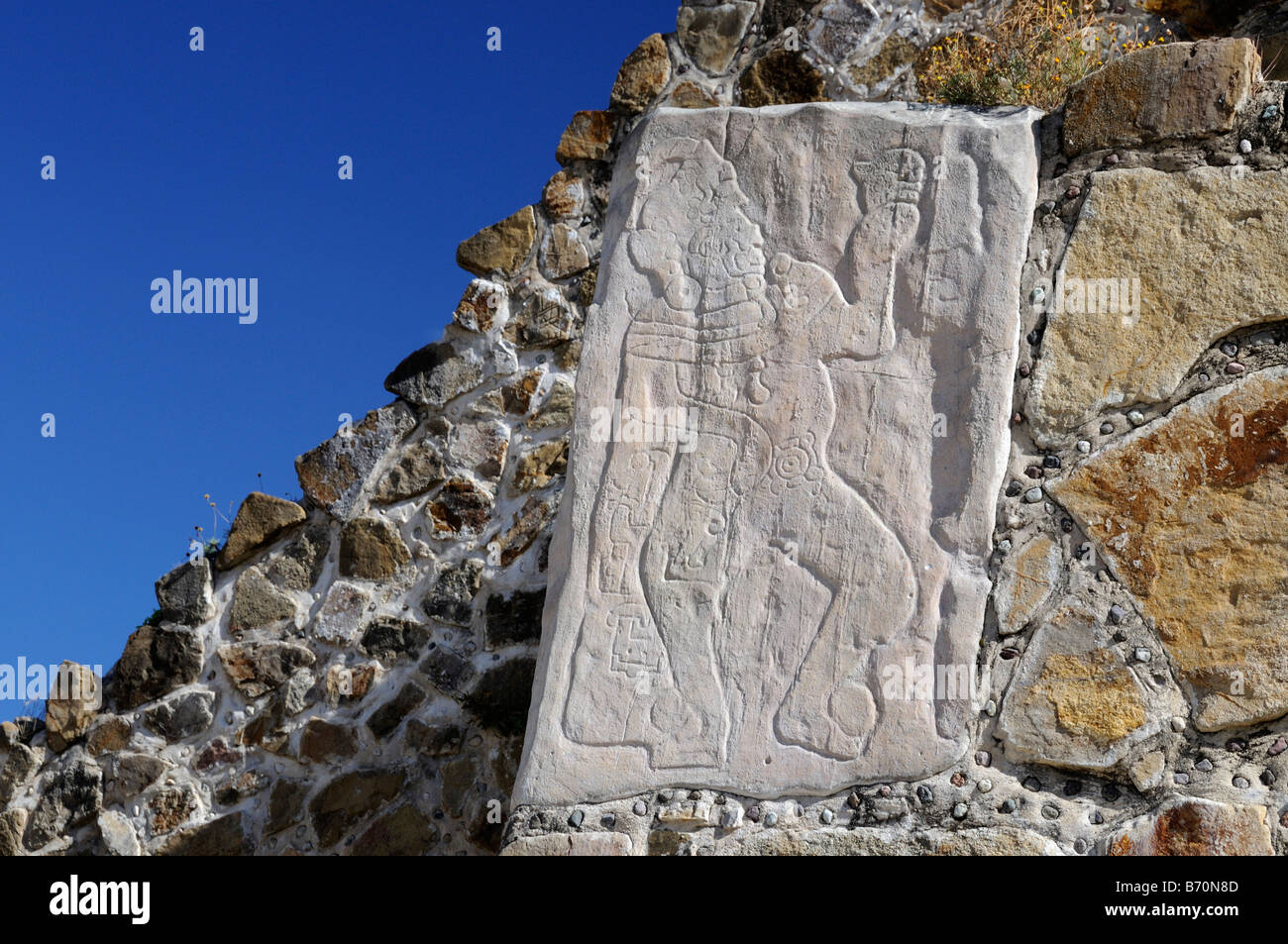 Carving of warrior, ancient city of Monte Alban, Mexico Stock Photo - Alamy