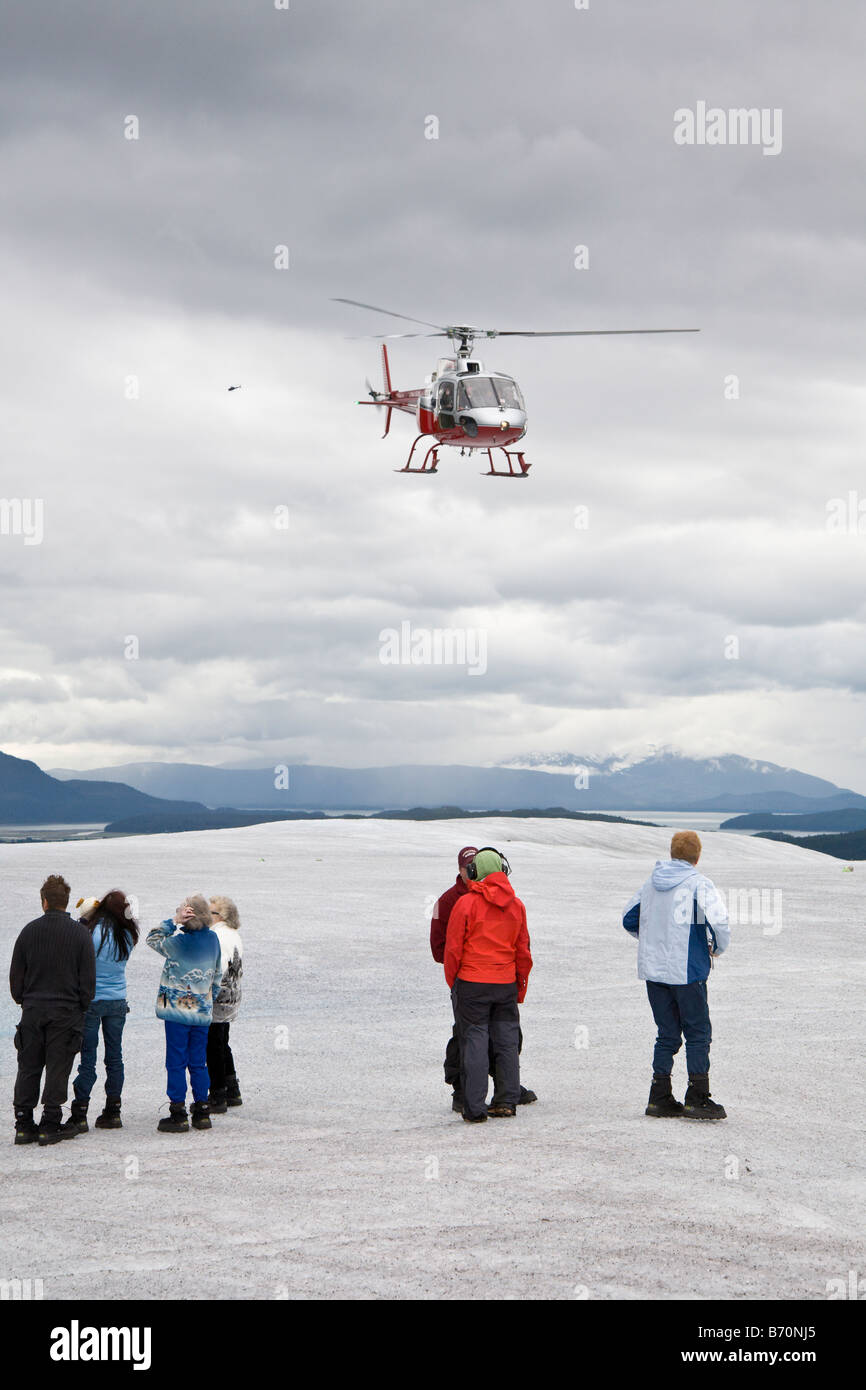 Helicopter transports tourists to Mendenhall Glacier near Juneau, Alaska Stock Photo