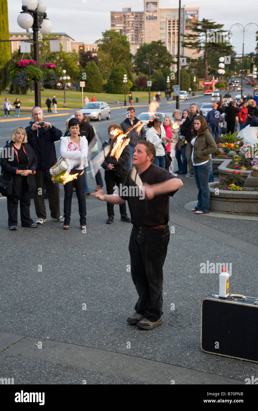 Street performer juggling in front of the Inner Harbour in Victoria, British Columbia, Canada Stock Photo