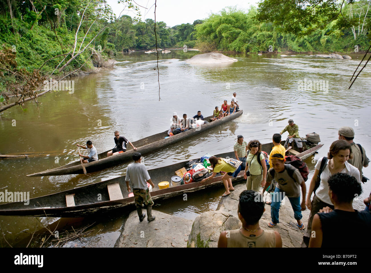 Suriname, Kwamalasamutu, Tourists arriving in tourist lodge called Iwana Samu. Sipaliwini river. Stock Photo