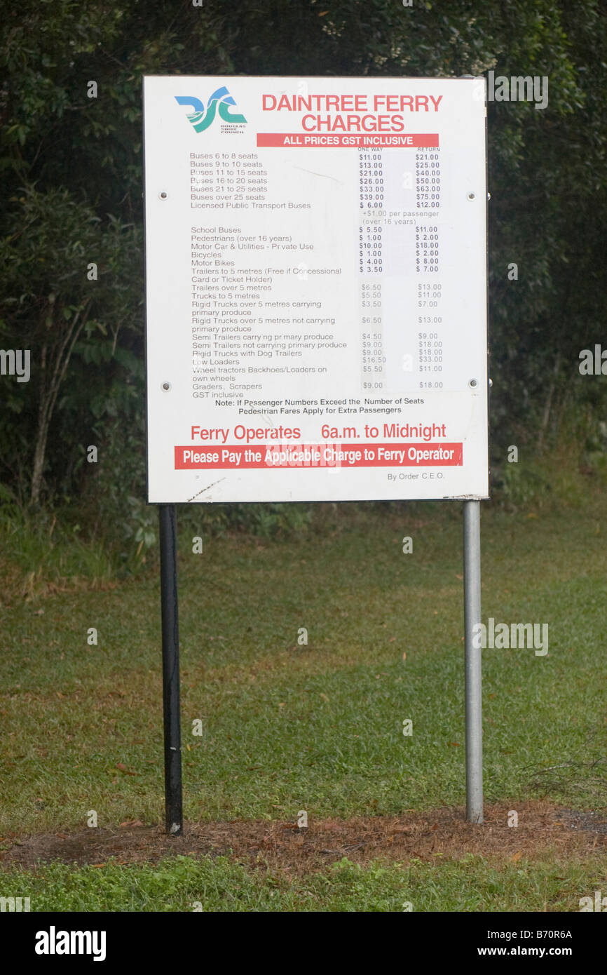 A sign shows the costs for crossing the Daintree River by car ferry, Queensland, Australia Stock Photo