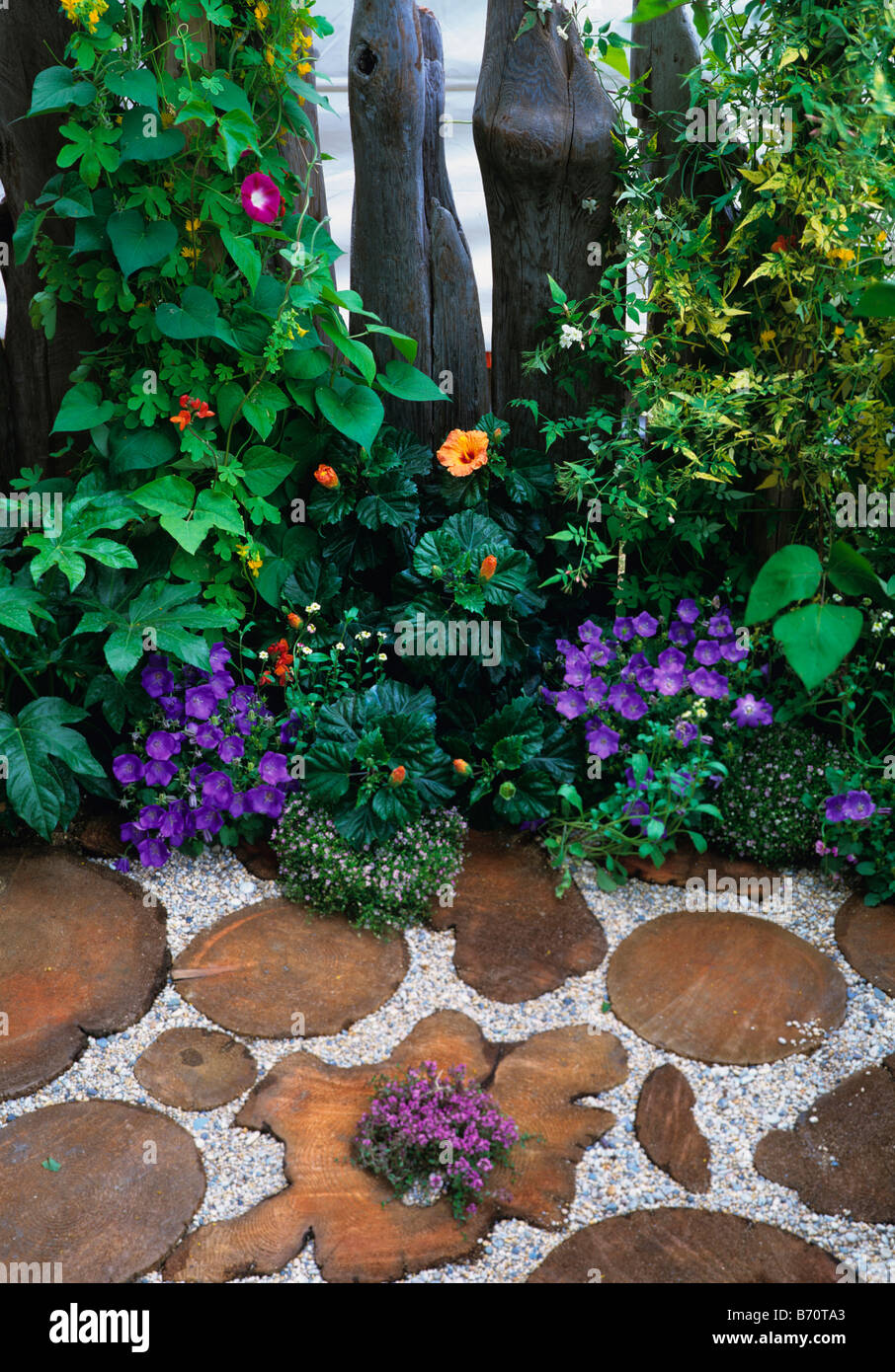 Potter's Retreat garden with wood block floor covering Stock Photo