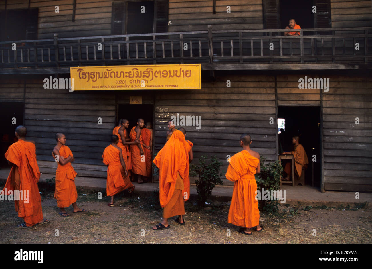 Novice Buddhist Monks outside Song Upper Secondary School, Wat Luang Monastery, Pakse, southern Laos Stock Photo